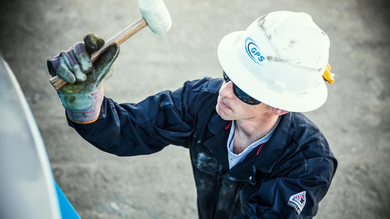 Worker With Hard Hat And Hammer
