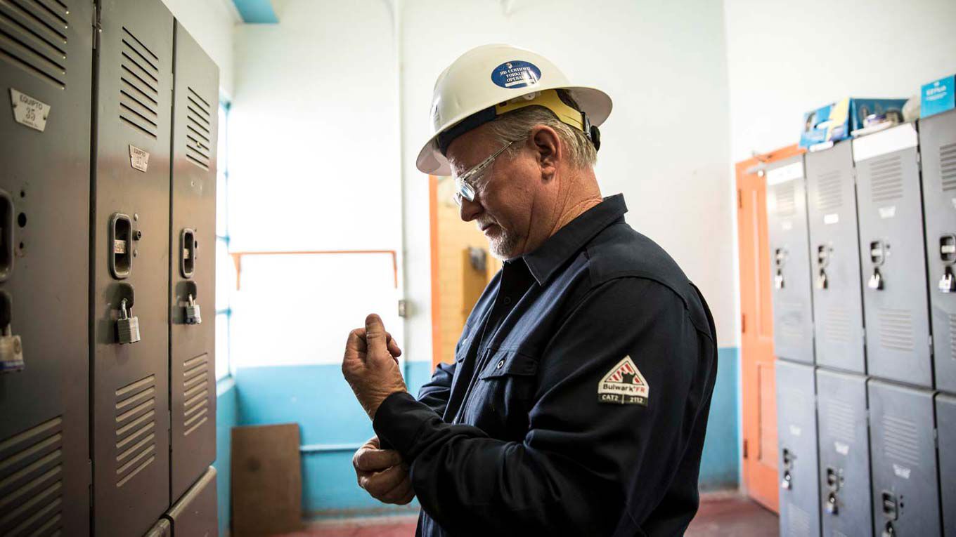 A Man Standing By Lockers